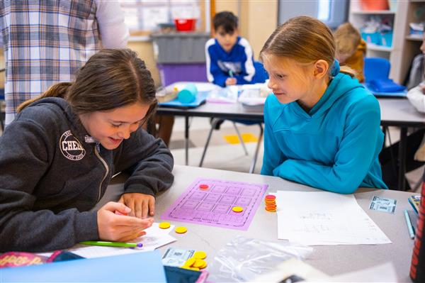Students inside their classrooms learning. v
